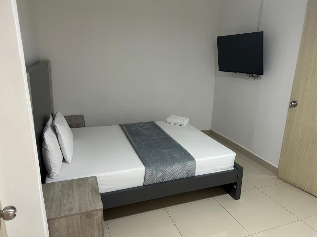 Postel nebo postele na pokoji v ubytování Hotel Ciento Once Boutique Laureles