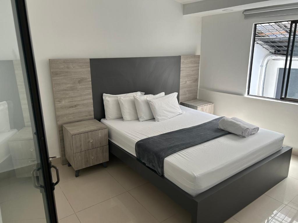 Postel nebo postele na pokoji v ubytování Hotel Ciento Once Boutique Laureles