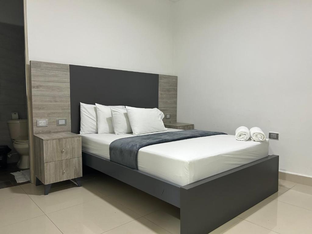Postel nebo postele na pokoji v ubytování Hotel Ciento Once Boutique Laureles