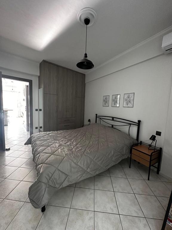 Ένα ή περισσότερα κρεβάτια σε δωμάτιο στο Iris Apartment Nafpaktos