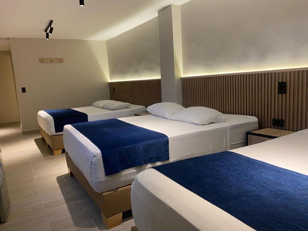 Postel nebo postele na pokoji v ubytování Hotel Suramericana