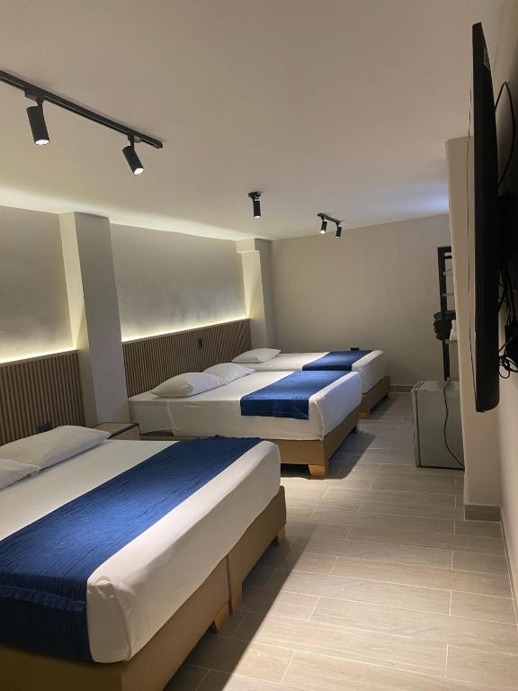 Postel nebo postele na pokoji v ubytování Hotel Suramericana