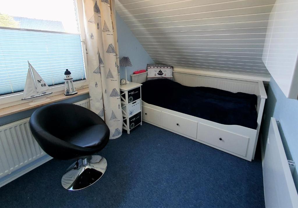 Postel nebo postele na pokoji v ubytování Ferienhaus Marina III