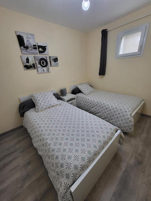 Postel nebo postele na pokoji v ubytování LE TOURISTIC Appartements