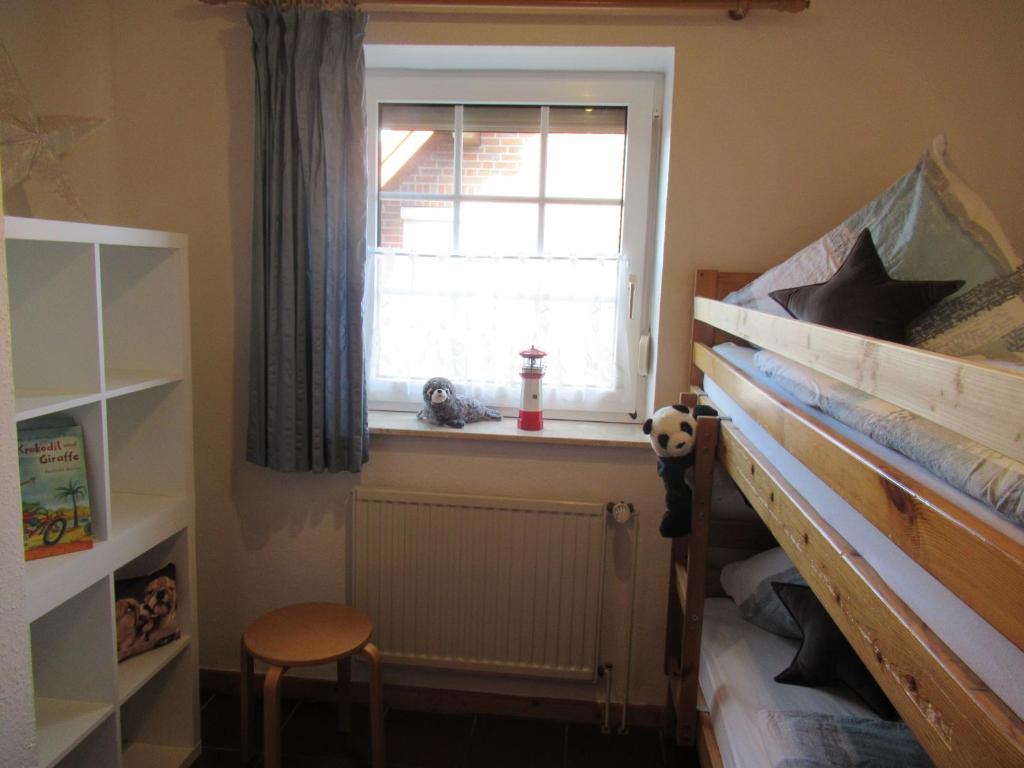 Postel nebo postele na pokoji v ubytování Ferienhaus Hooksiel mit Sauna und Kamin