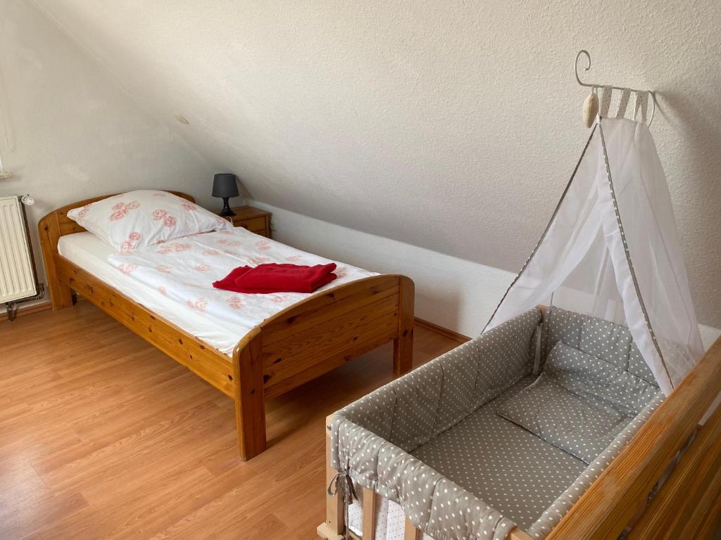 Postel nebo postele na pokoji v ubytování Ferienhaus Hooksiel mit Sauna und Kamin