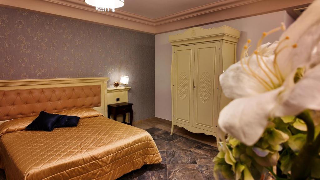 Postel nebo postele na pokoji v ubytování Regina di Saba - Hotel Villa per ricevimenti