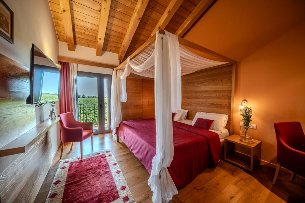 Postel nebo postele na pokoji v ubytování Borgo Ronchetto