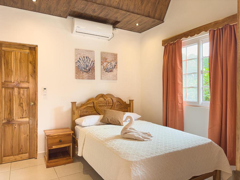 Postel nebo postele na pokoji v ubytování Hostal Familiar Rolo
