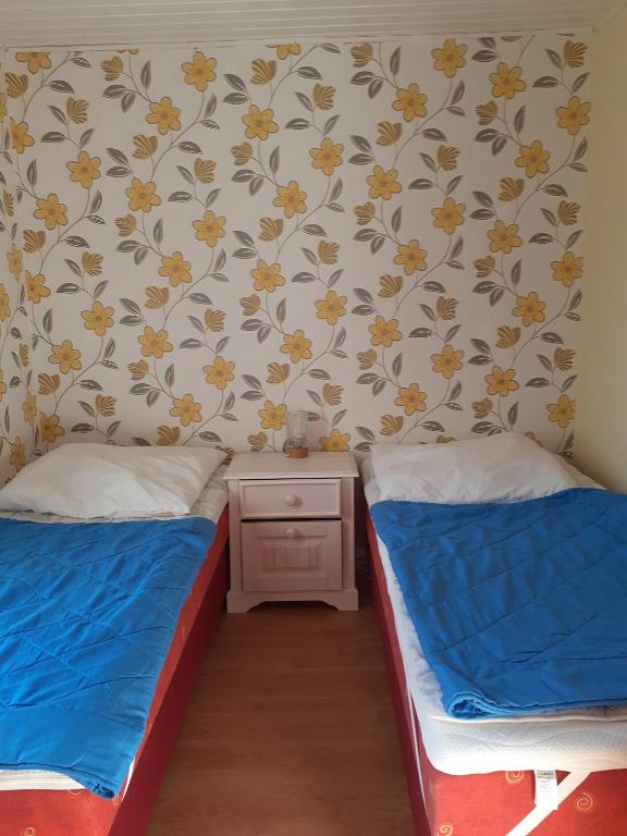 Postel nebo postele na pokoji v ubytování Ferienhaus Petersdorfer See