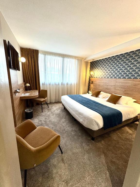 Postel nebo postele na pokoji v ubytování Best Western Hotel Le Quercy