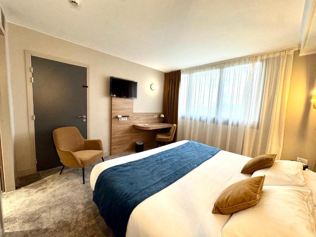 Postel nebo postele na pokoji v ubytování Best Western Hotel Le Quercy