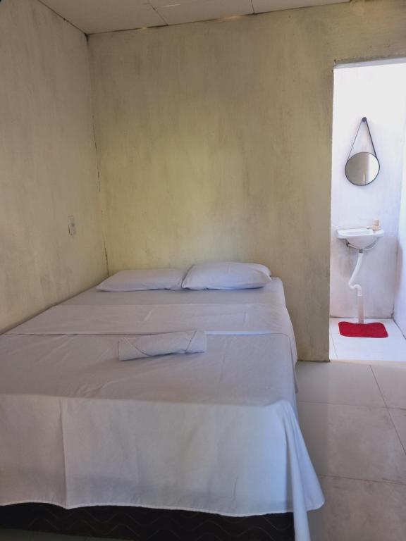 Ένα ή περισσότερα κρεβάτια σε δωμάτιο στο Quarto casal ventilador