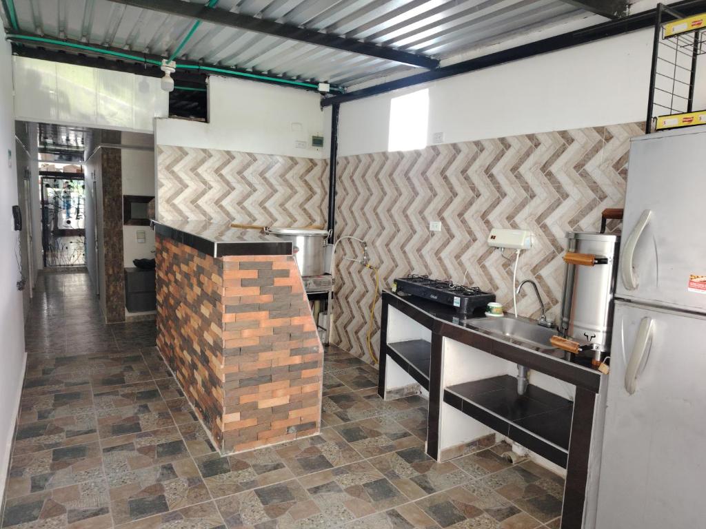 Kuchyň nebo kuchyňský kout v ubytování Hotel Palmari