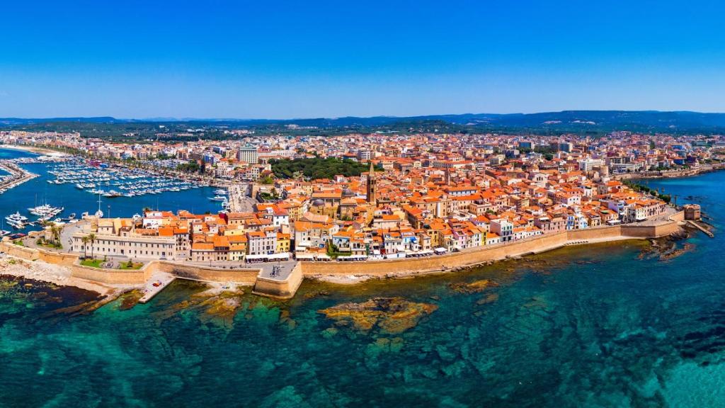 an aerial view of a city with a harbor at Villa Sant Anna in Alghero