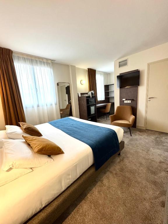 Postel nebo postele na pokoji v ubytování Best Western Hotel Le Quercy