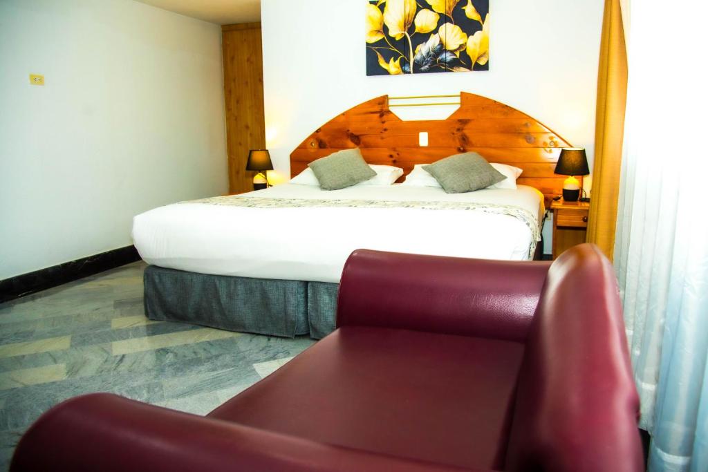 Postel nebo postele na pokoji v ubytování Hotel la Giralda