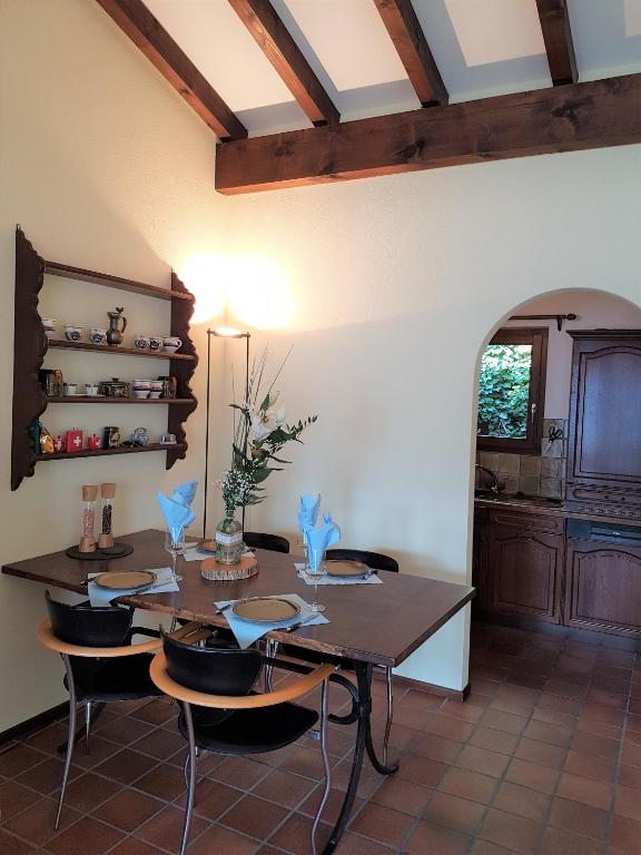 a dining room with a table and some chairs at "Vista dolce" in Brissago