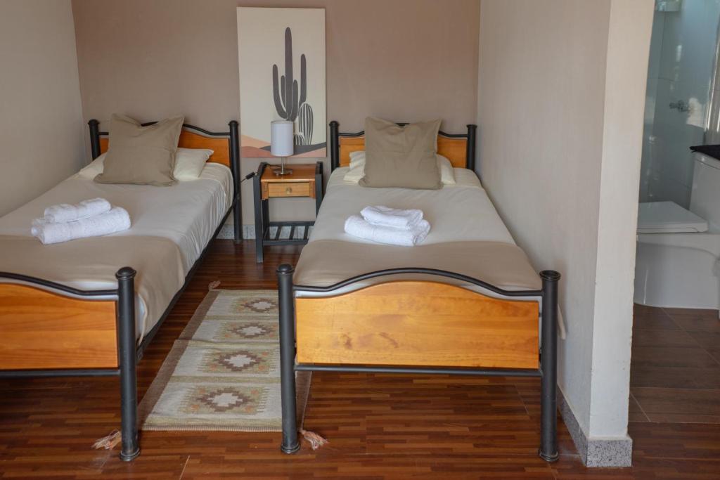 Postel nebo postele na pokoji v ubytování Hostal Katarpe