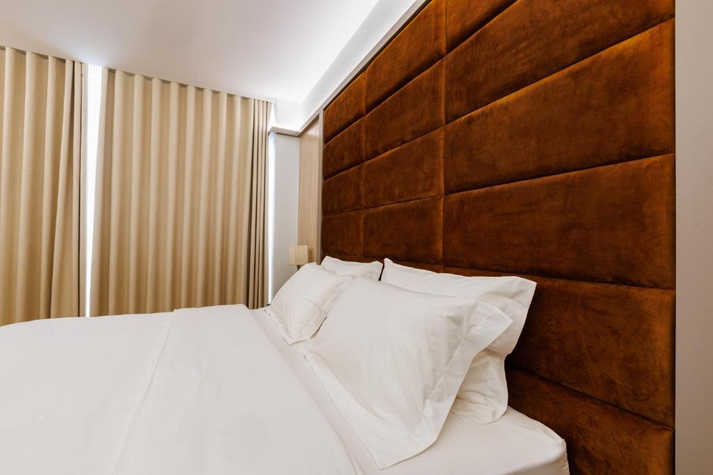 Postel nebo postele na pokoji v ubytování Hotel Fieri