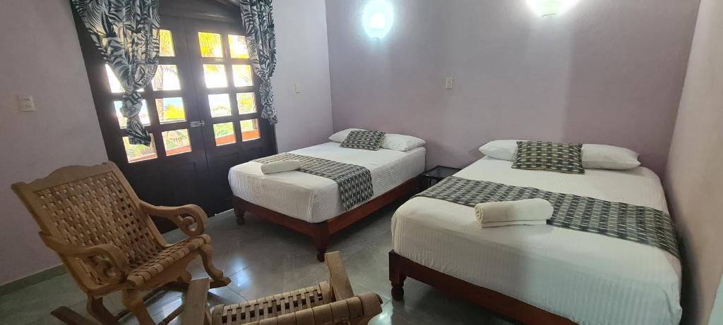 Postelja oz. postelje v sobi nastanitve Hotel Rosa de los vientos