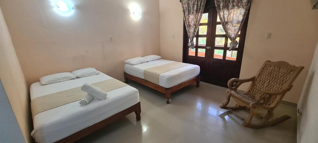 Postelja oz. postelje v sobi nastanitve Hotel Rosa de los vientos