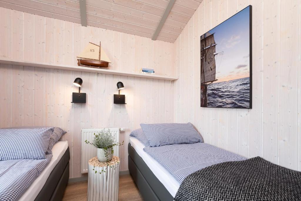 Postel nebo postele na pokoji v ubytování Strandpark 41