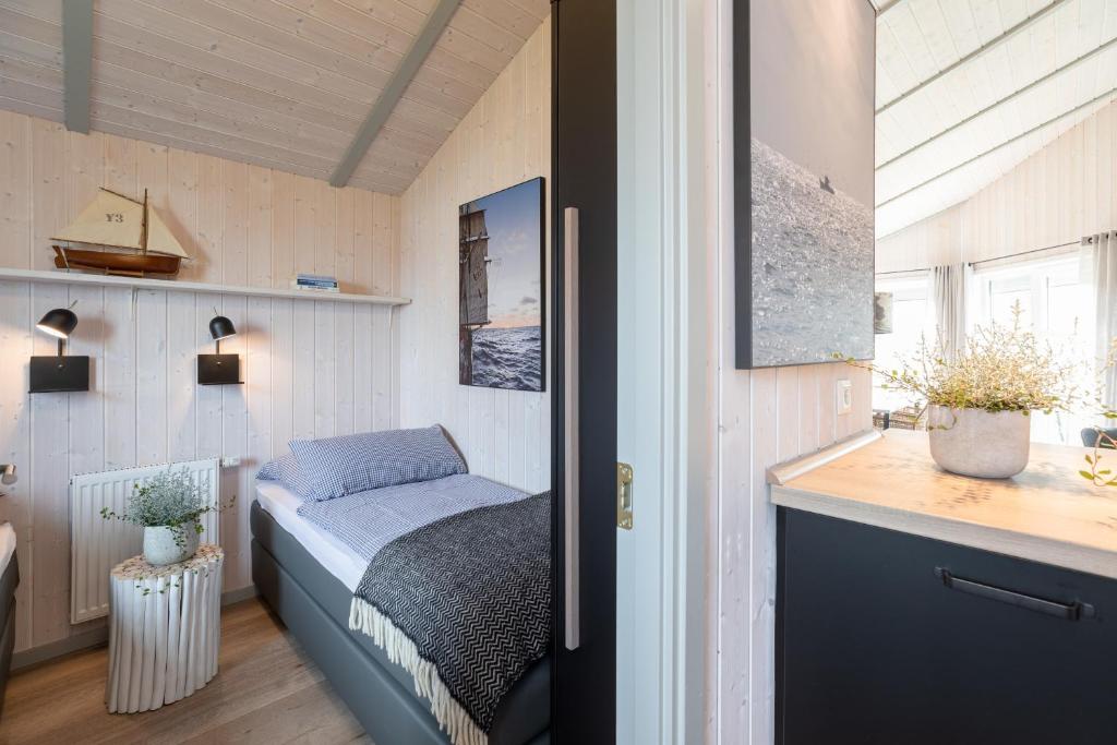 Postel nebo postele na pokoji v ubytování Strandpark 41