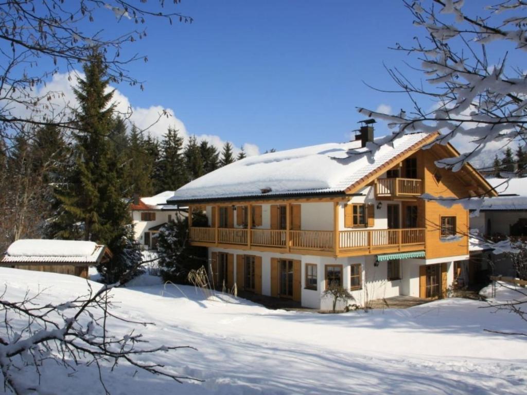 a log home in the snow with snow at Abendruh -566- in Krün