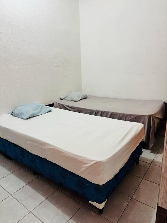 Postel nebo postele na pokoji v ubytování Gually Hostel