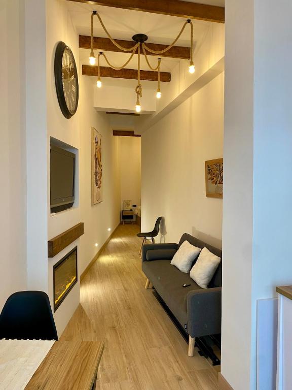a living room with a couch and a fireplace at Acogedor bajo en Valencia in Valencia