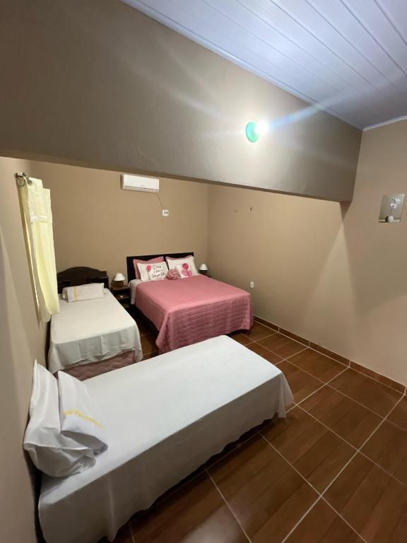 Postel nebo postele na pokoji v ubytování Hostel Caiçara
