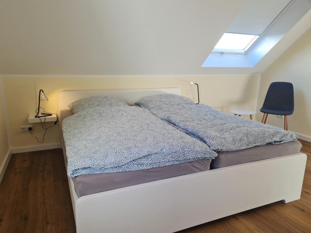 Postel nebo postele na pokoji v ubytování Ferienwohnung Dons - Strandnahe & moderne Fewo im Ostseebad Grömitz