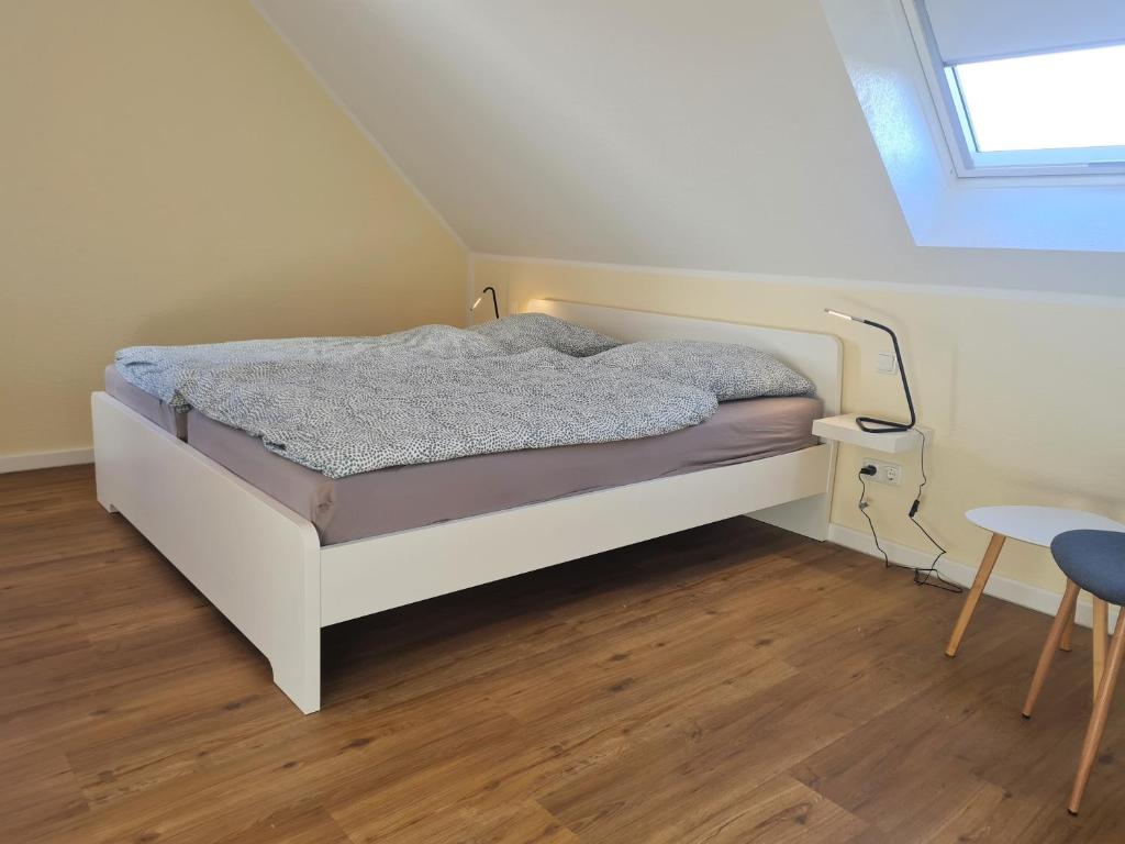 Postel nebo postele na pokoji v ubytování Ferienwohnung Dons - Strandnahe & moderne Fewo im Ostseebad Grömitz