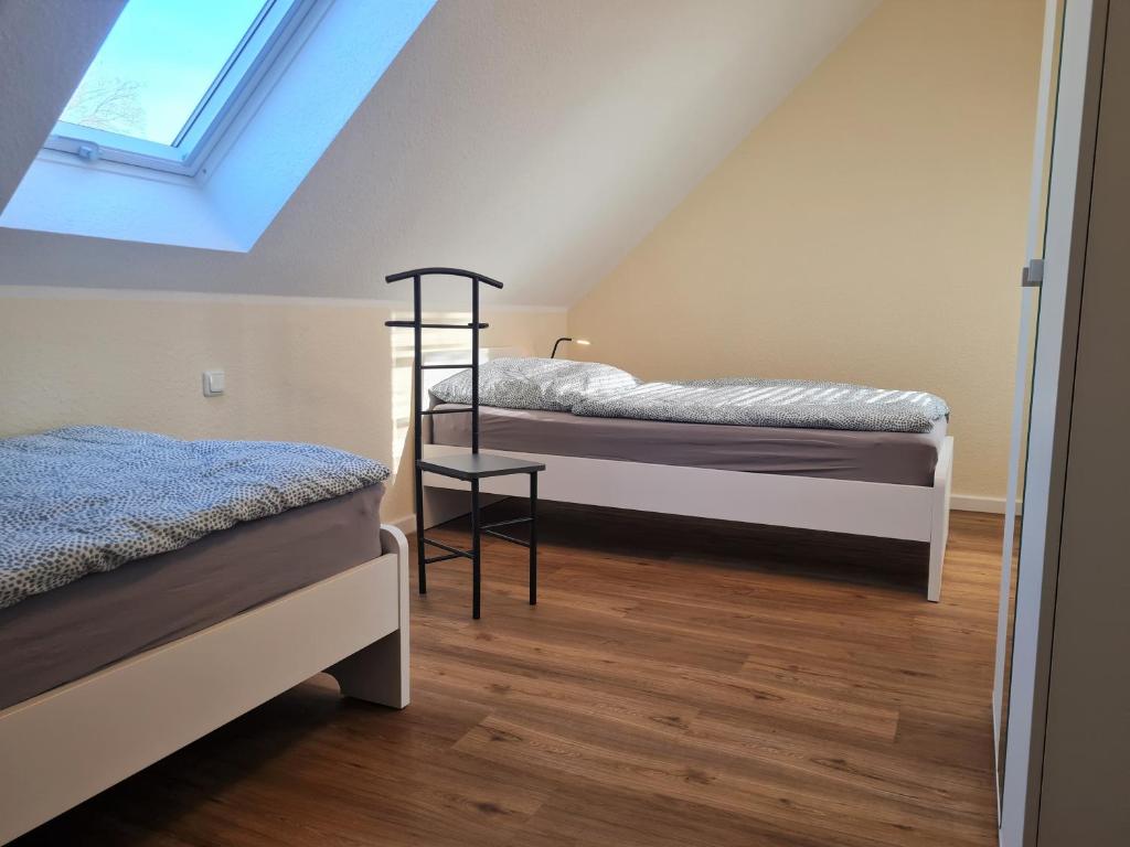 Postel nebo postele na pokoji v ubytování Ferienwohnung Dons - Strandnahe & moderne Fewo im Ostseebad Grömitz