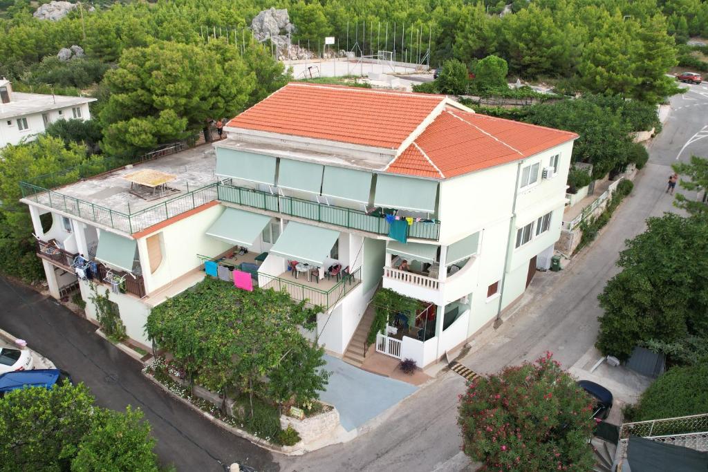 an aerial view of a house with an orange roof at Apartments with parking space Zivogosce - Blato, Makarska - 23922 in Živogošće