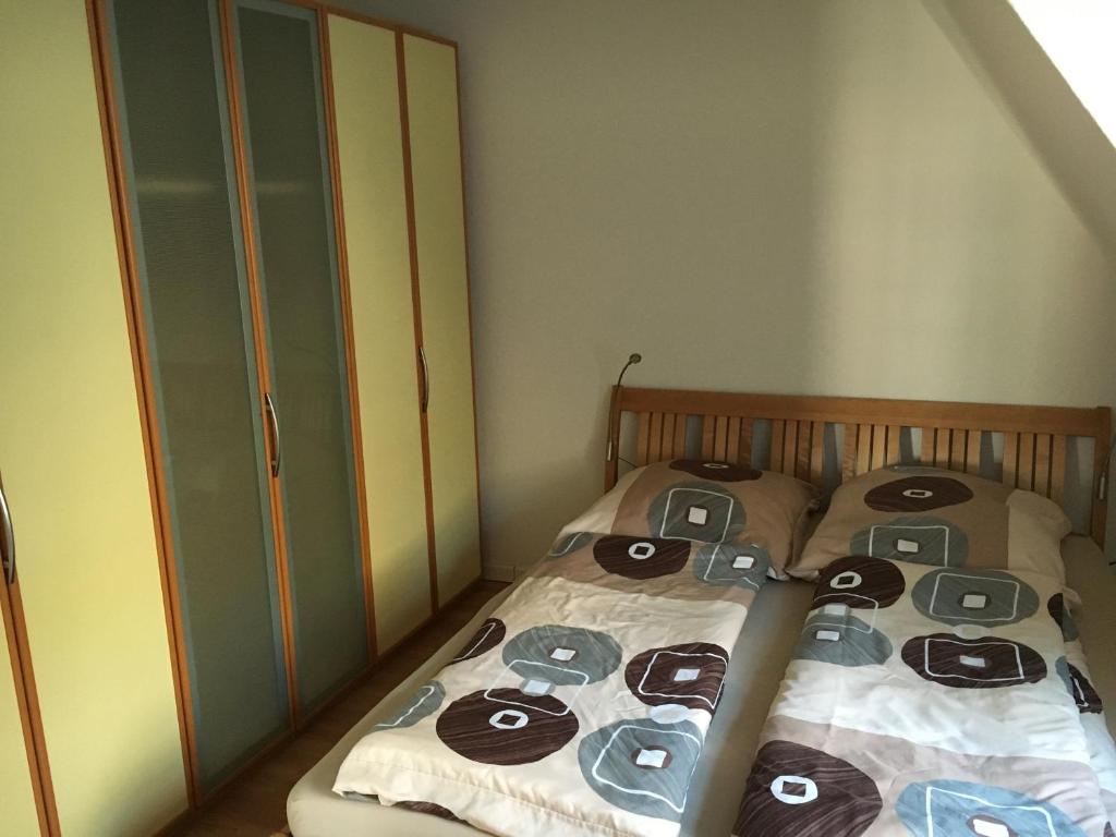 Säng eller sängar i ett rum på Zweite Heimat Ferienwohnungen