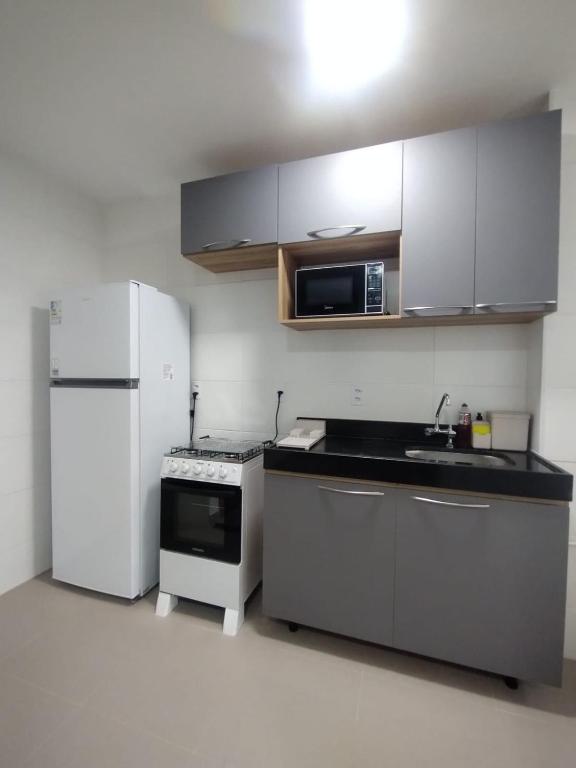 Kuchyň nebo kuchyňský kout v ubytování Apartamento Espaço Aruba