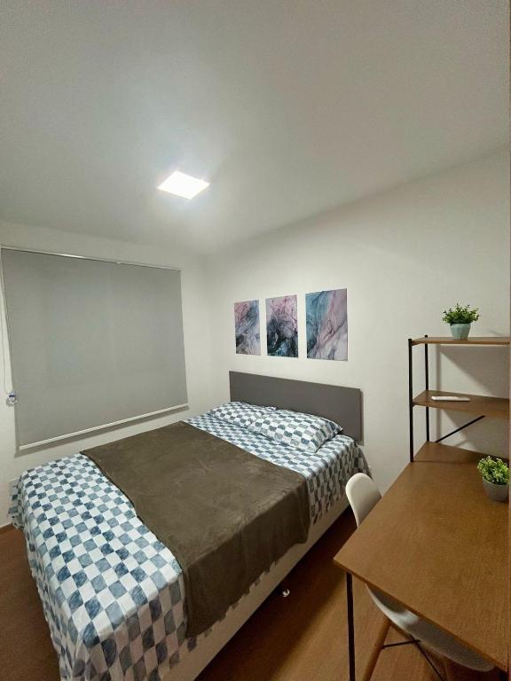 Postel nebo postele na pokoji v ubytování Apartamento Espaço Aruba