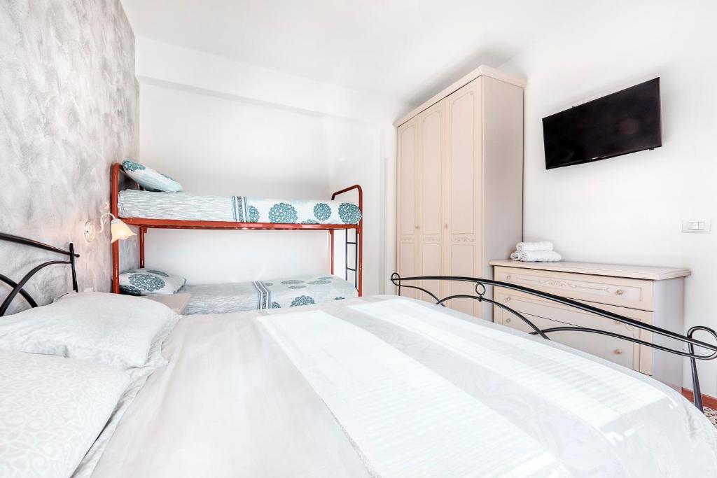 Postel nebo postele na pokoji v ubytování Jesolo Happy Beach House - Host Solution