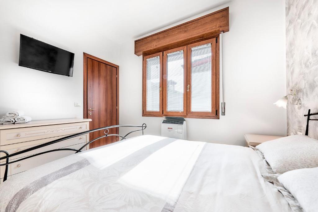 Postel nebo postele na pokoji v ubytování Jesolo Happy Beach House - Host Solution