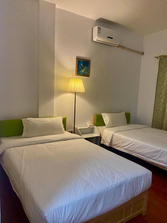Postel nebo postele na pokoji v ubytování Green Mango Resort