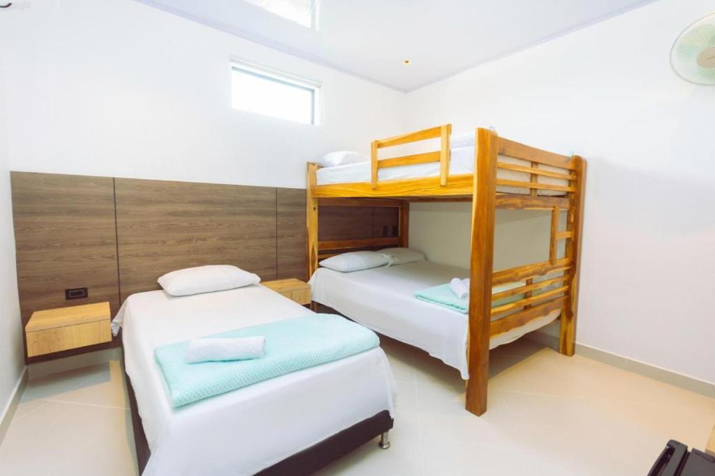 Postel nebo postele na pokoji v ubytování Hotel Luna Verde