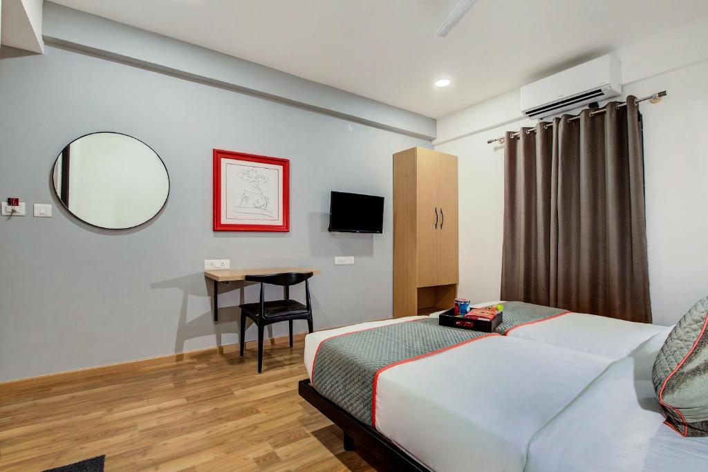 Postel nebo postele na pokoji v ubytování Hotel O Evergreen