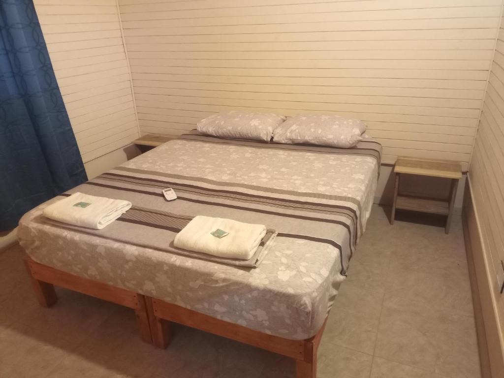 Postel nebo postele na pokoji v ubytování Angiru cabañas