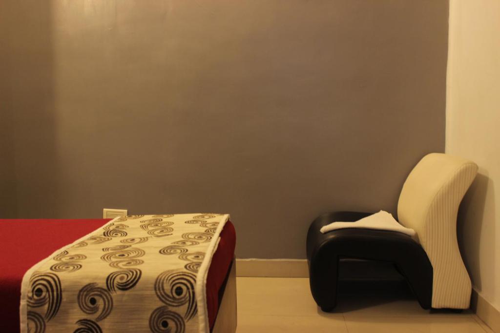 Postel nebo postele na pokoji v ubytování Mount Residency