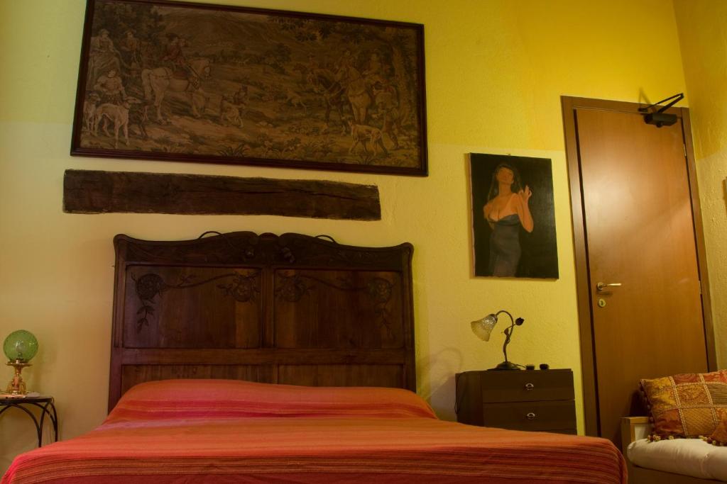 Postel nebo postele na pokoji v ubytování Arco Dei Nobili