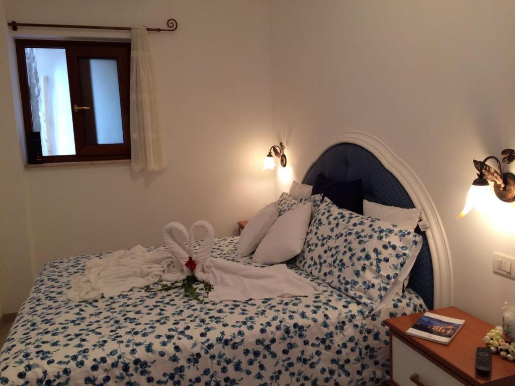 Postel nebo postele na pokoji v ubytování Casetta Anacaprese