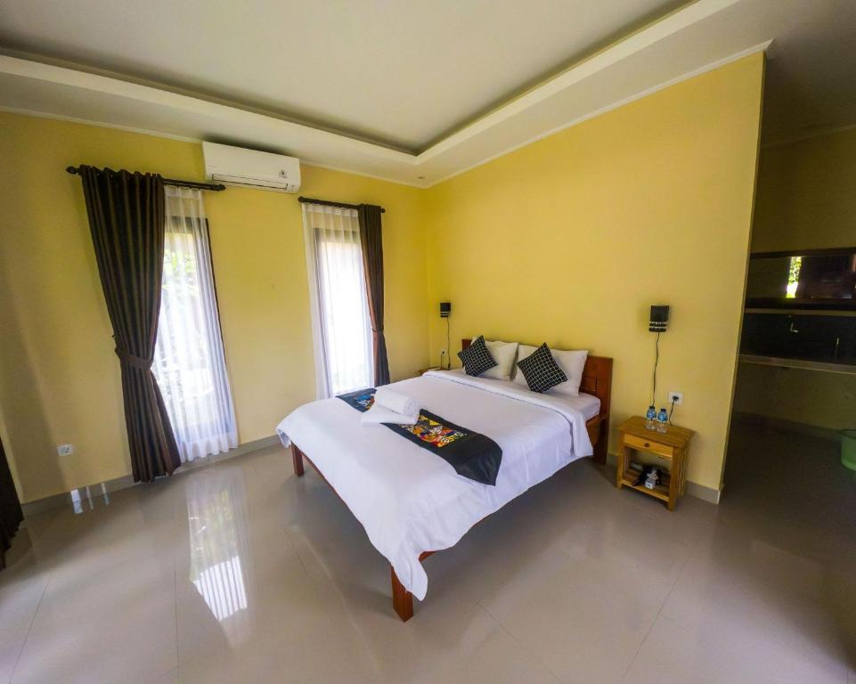 Letto o letti in una camera di Intan sidemen villa