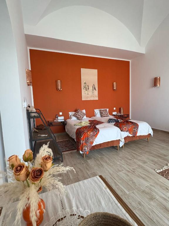 Postel nebo postele na pokoji v ubytování Maison d'hôtes Dar El Kahina Djerba